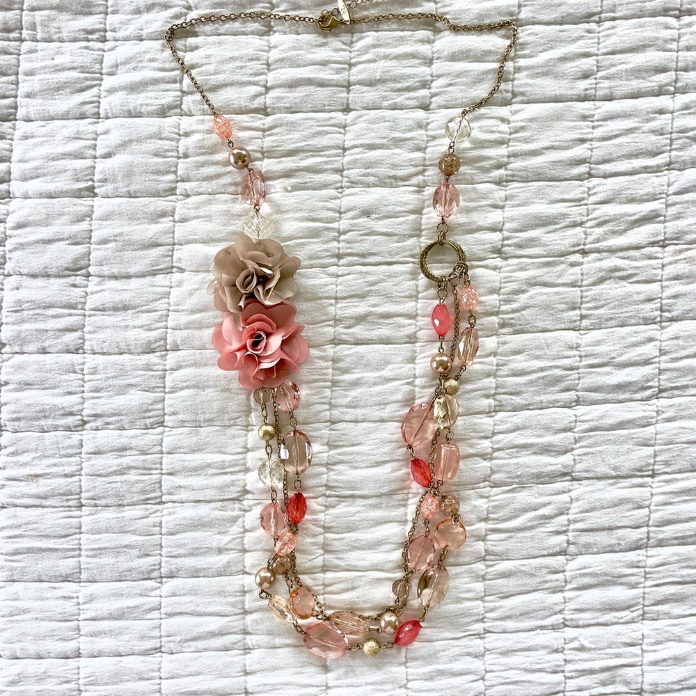 New York and Company long beaded necklace with flowers on silver chain.